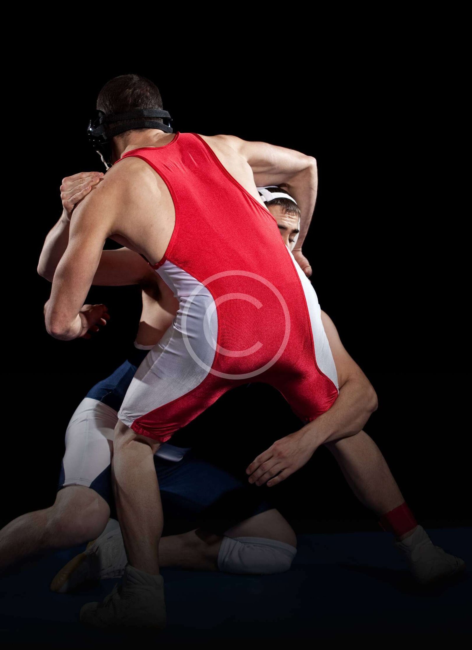 Two Wrestling fighters Showing Their Skills on the Mat